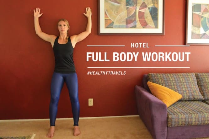 Full body workout pose inside hotel room
