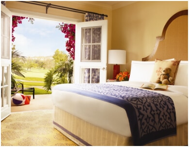 upscale bedroom at la costa with french doors leading to grounds