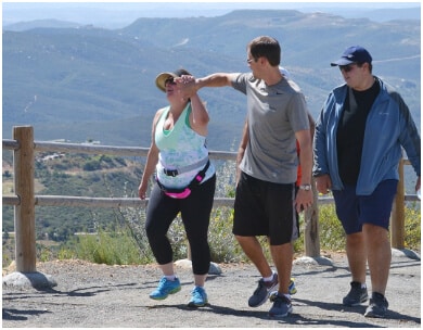 Weight loss camp participants walk to improve wellness & fitness