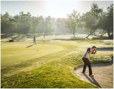 Two people golfing at the course at La Costa Resort