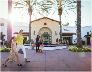 Woman and daughter walk outside at the La Costa Resort in San Diego