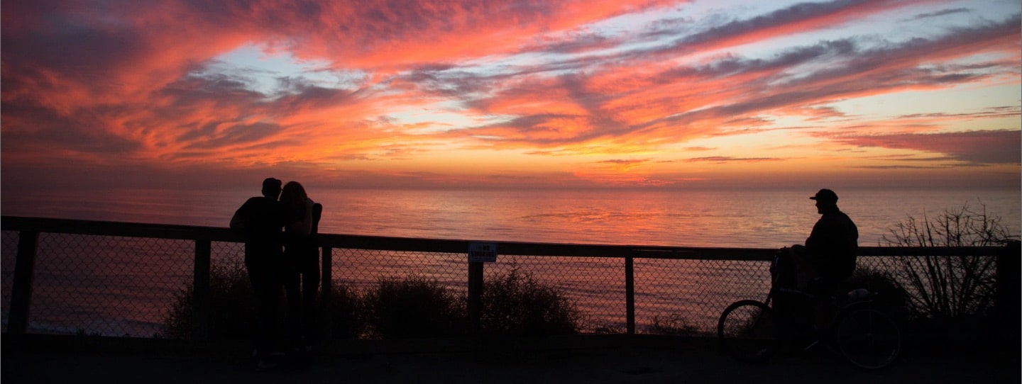 Bright orange & pink San Diego Sunset next to the ocean