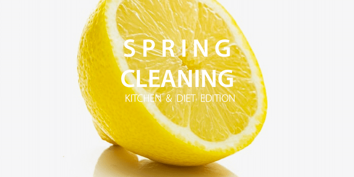 sliced lemon on table with "SPRING CLEANING" written above