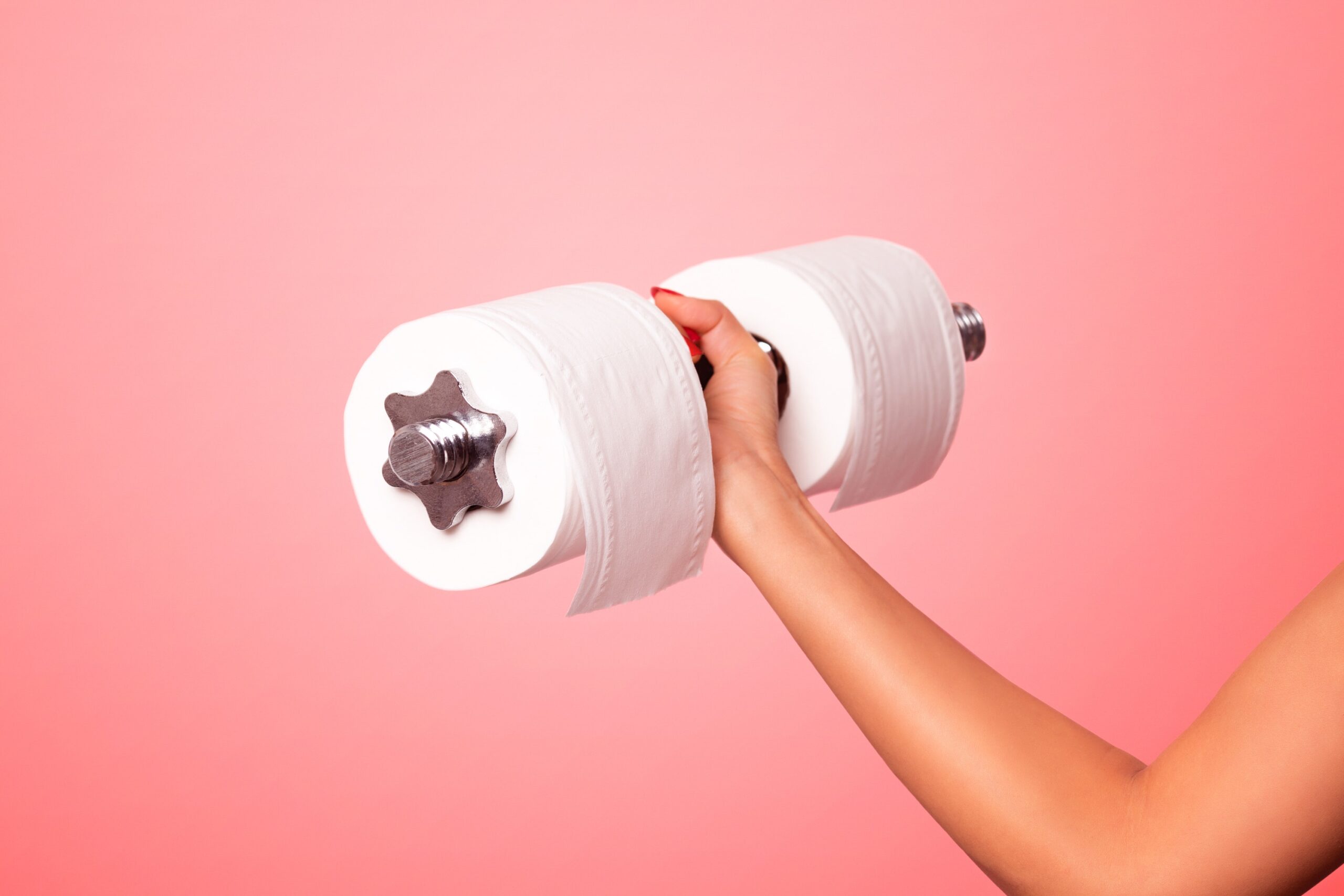 arm holds dumbbell with toilet paper on either end