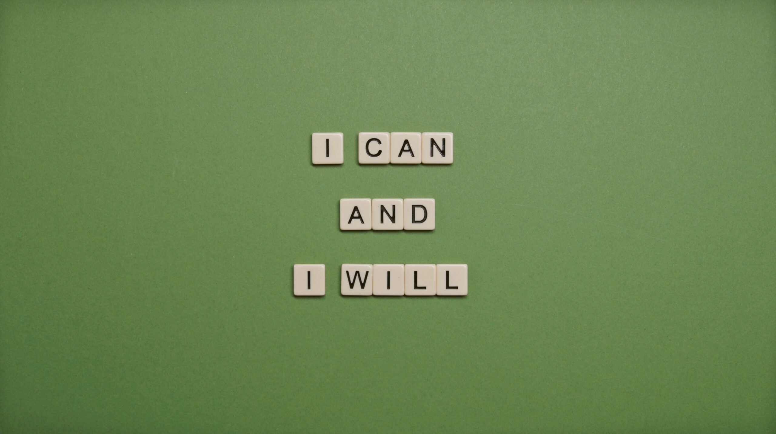 small letters form I CAN AND I WILL on a green background